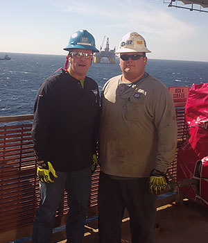 Chip, safety paramedic at H&P, pictured with his son Kendal on offshore rig.